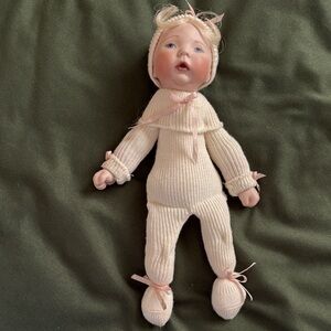 Charming Knit Baby Doll with Pink Accents